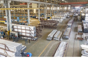Shengxin powder coating line applying anthracite grey finish to aluminum louvered fence panels for a residential project