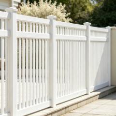 Aluminum backyard fence panel with vertical pickets and matching gate installed on lawn