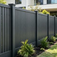 Aluminum boundary fence panel marking property line with black finish